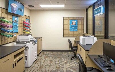 Business center with computers, printers and ergonomic chairs at Hilton Minneapolis.