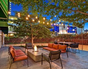 Hotel terrace with lounge seating and fire pit at Hilton Minneapolis.