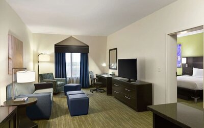 Day use suite with living room and workspace at Hilton Garden Inn Houston NW/Willowbrook.