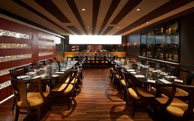 The hotel’s restaurant has a hard floor, long tables, and serves Italian coastal cuisine.