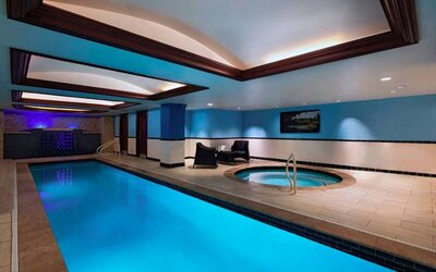 The Stephen F Austin Royal Sonesta Hotel’s narrow indoor pool has two armchairs nearby, plus a hot tub.