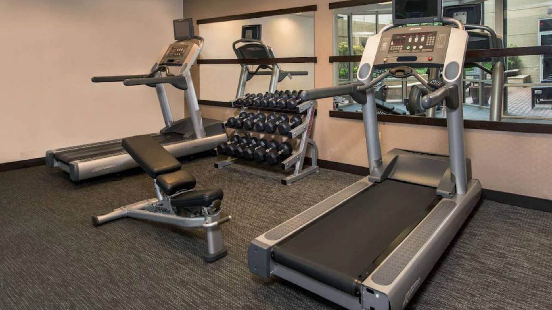 The hotel’s fitness center has racks of free weights, a bench, and treadmills for guests to use.