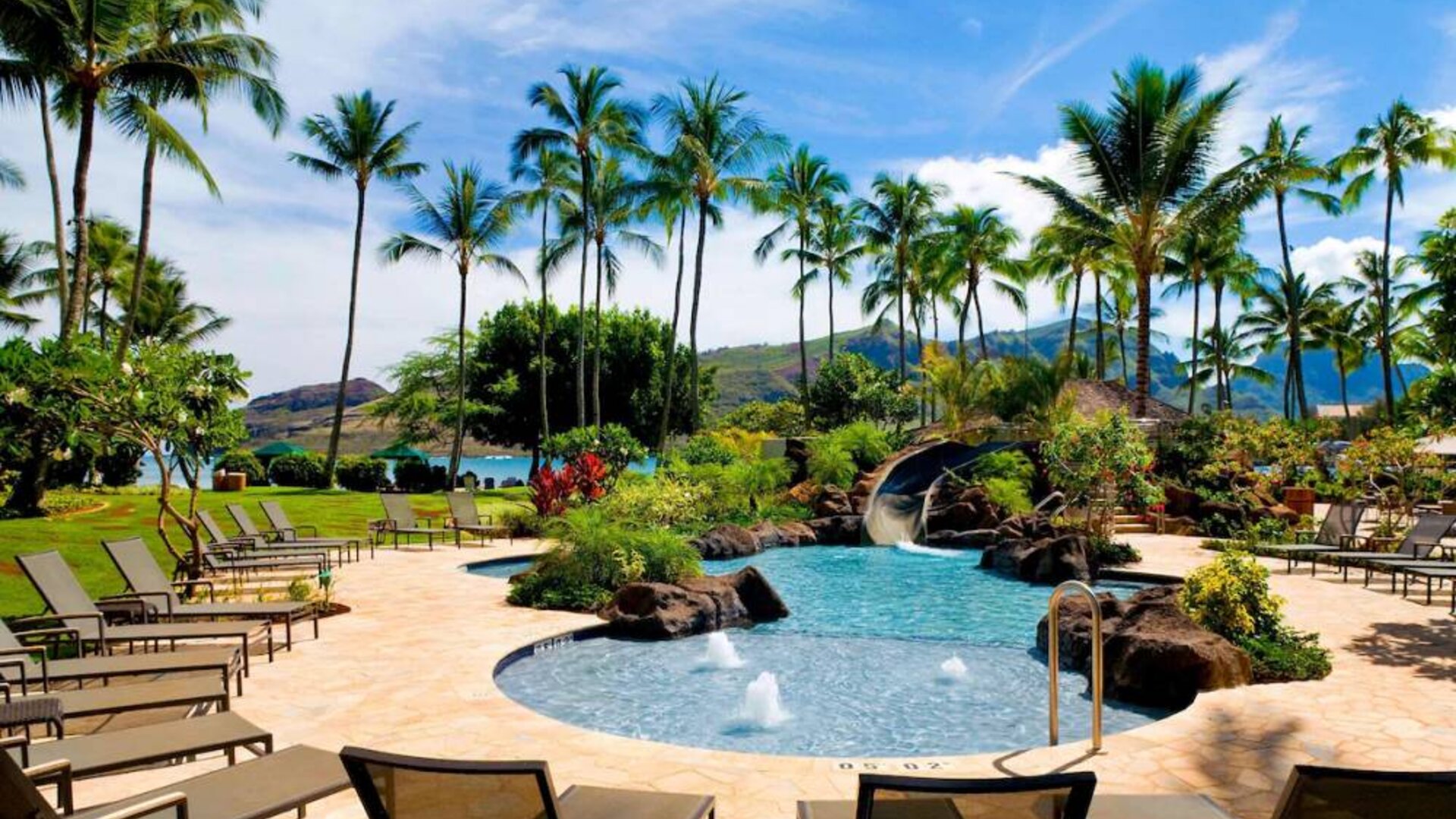 Beautiful outdoor pool with lounge chairs at Royal Sonesta Kaua'i Resort Lihue.