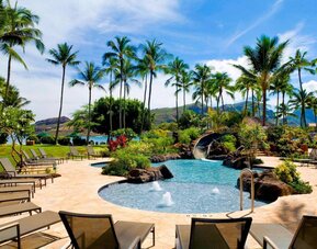 Beautiful outdoor pool with lounge chairs at Royal Sonesta Kaua'i Resort Lihue.