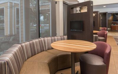 The hotel’s media pods offer a cozy setting for socializing or work, and each has a coffee table and TV.