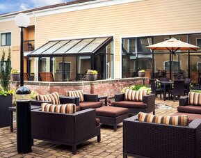 Sonesta Select Seattle Bellevue Redmond’s terrace is decorated with plants and provides armchairs and coffee tables.