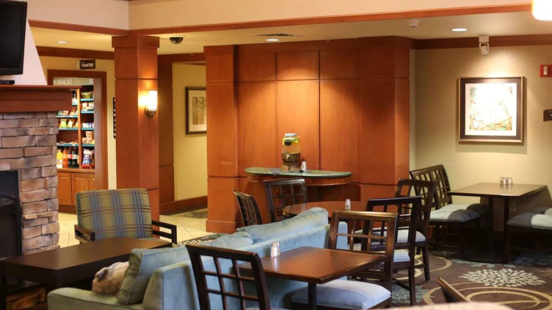 Sonesta ES Suites Portland Vancouver 41st Street’s lobby has extensive seating and numerous small tables.