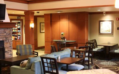 Sonesta ES Suites Portland Vancouver 41st Street’s lobby has extensive seating and numerous small tables.