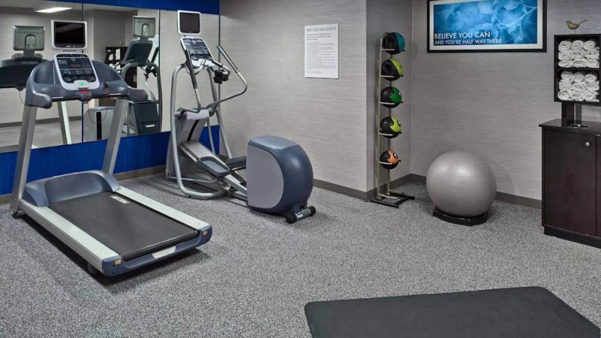 Sonesta ES Suites New Orleans’s fitness center is equipped with gym balls, exercise machines, and plenty of towels.