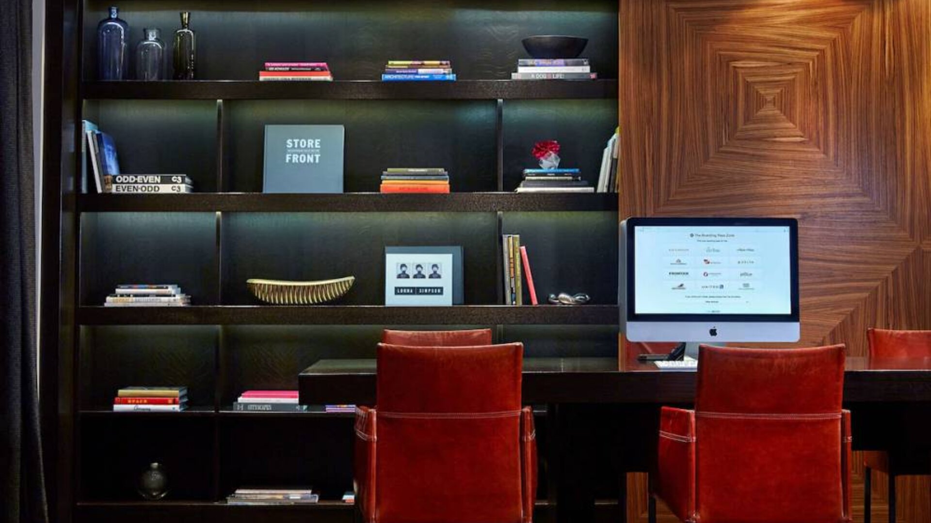 The hotel’s business center is located in the lobby and has a computer workstation and numerous chairs for co-working.