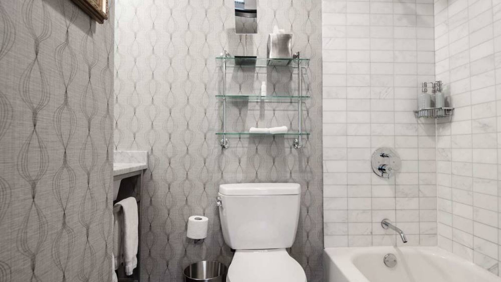 Guest bathroom in The Allegro Royal Sonesta Hotel Chicago Loop, featuring bath and shower, and a lavatory.