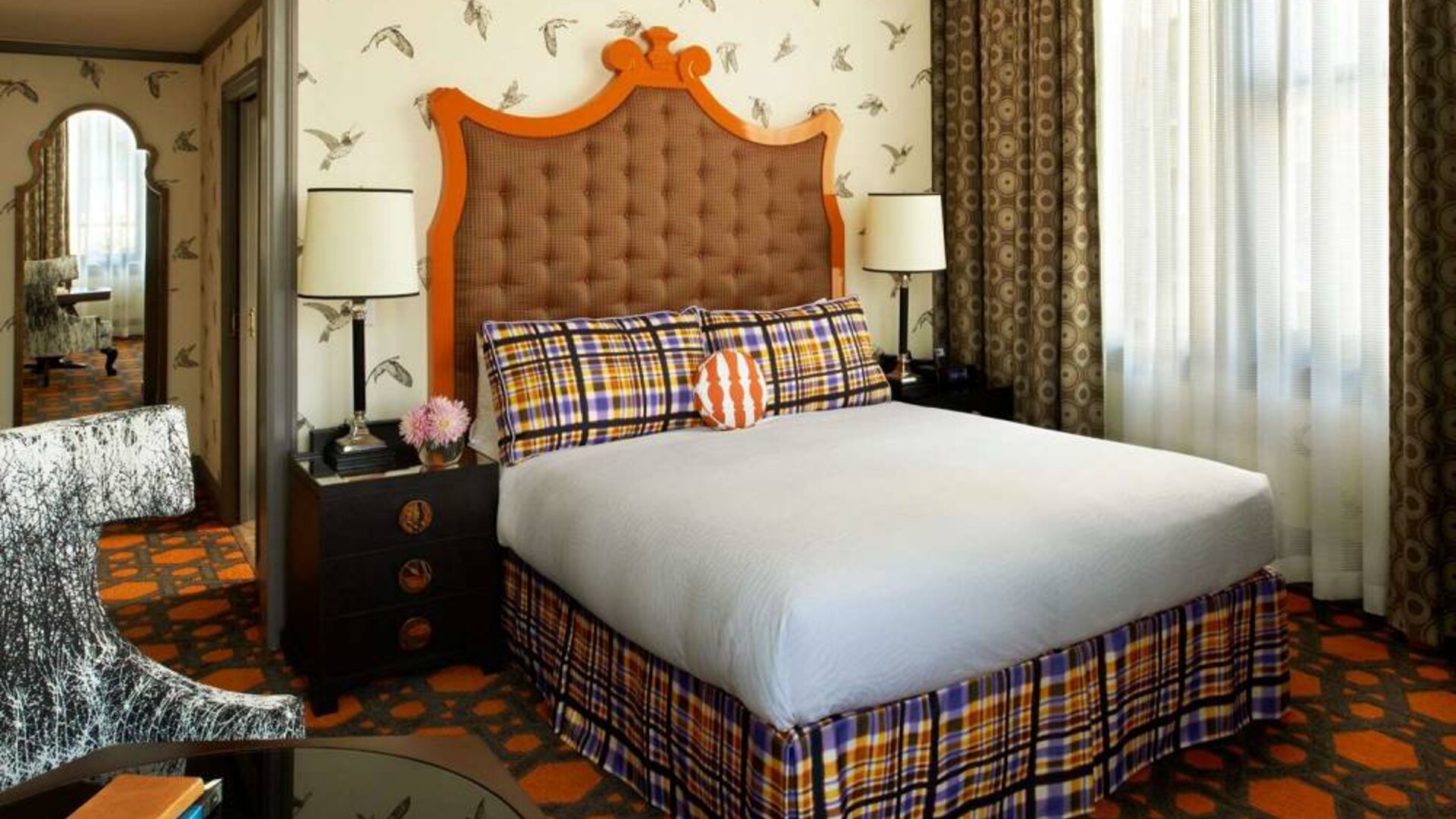 Royal Sonesta Portland Downtown double bed guest room, featuring chair, coffee table, and window.