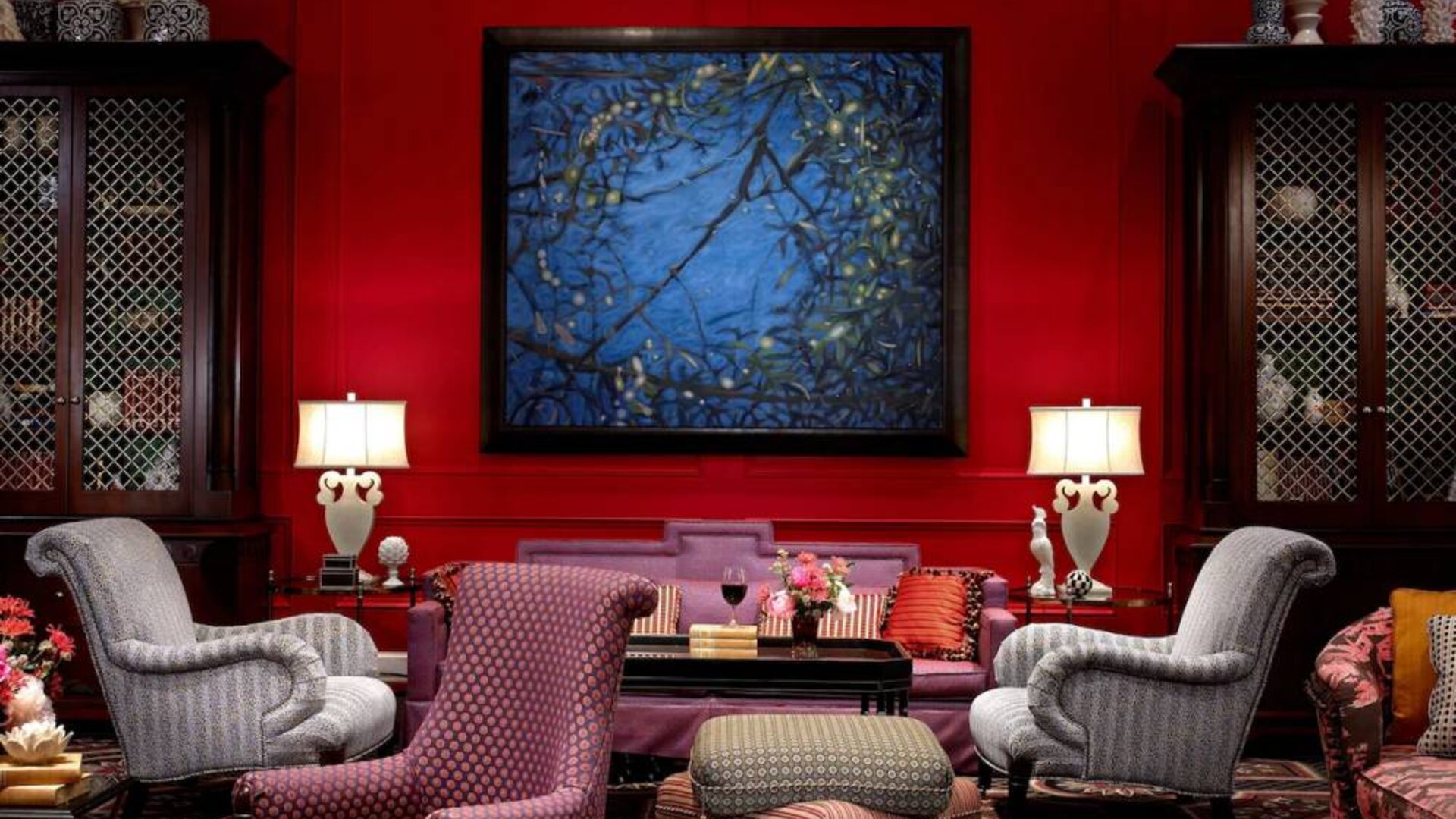The lobby lounge in Royal Sonesta Portland Downtown is furnished with comfortable armchair and sofa seating, coffee tables, and art on the wall.