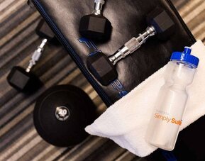 Sonesta Simply Suites Houston CityCentre I-10 West’s fitness center provides guests with free weights, benches, towels, and water.