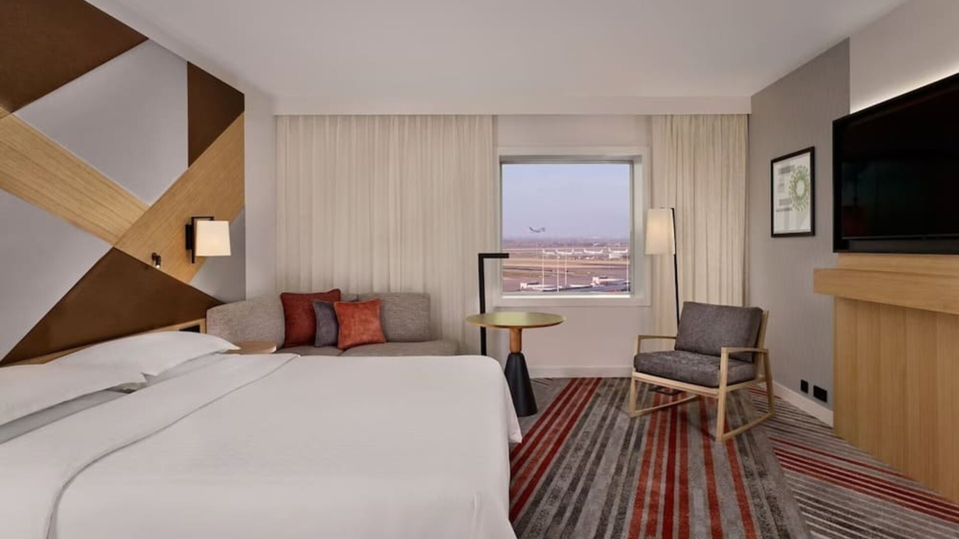 King room with TV at Sheraton Amsterdam Airport Hotel And Conference Center.