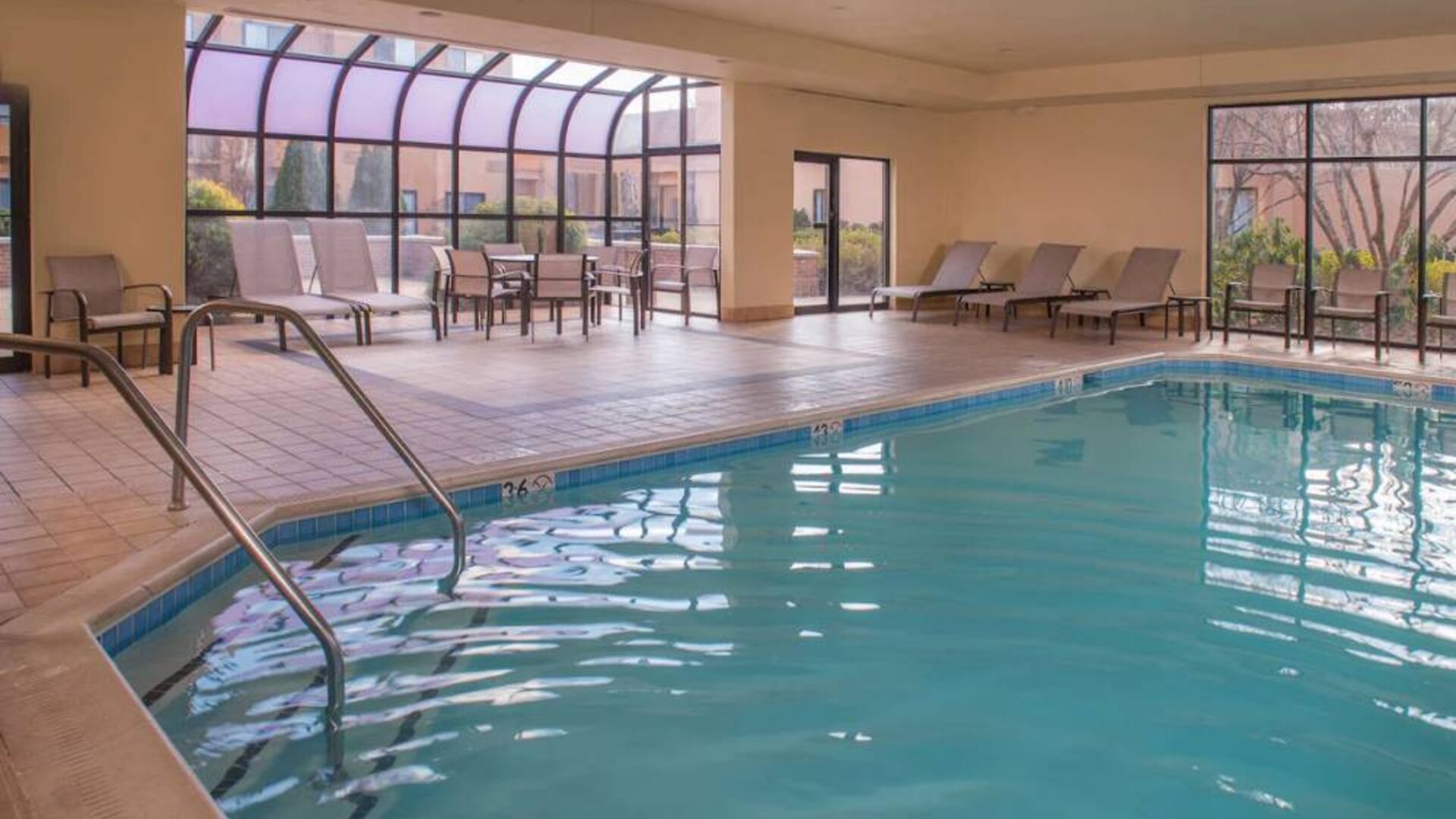 Sonesta Select Columbia’s indoor pool has large windows for plenty of light, and both loungers and chairs by the side.