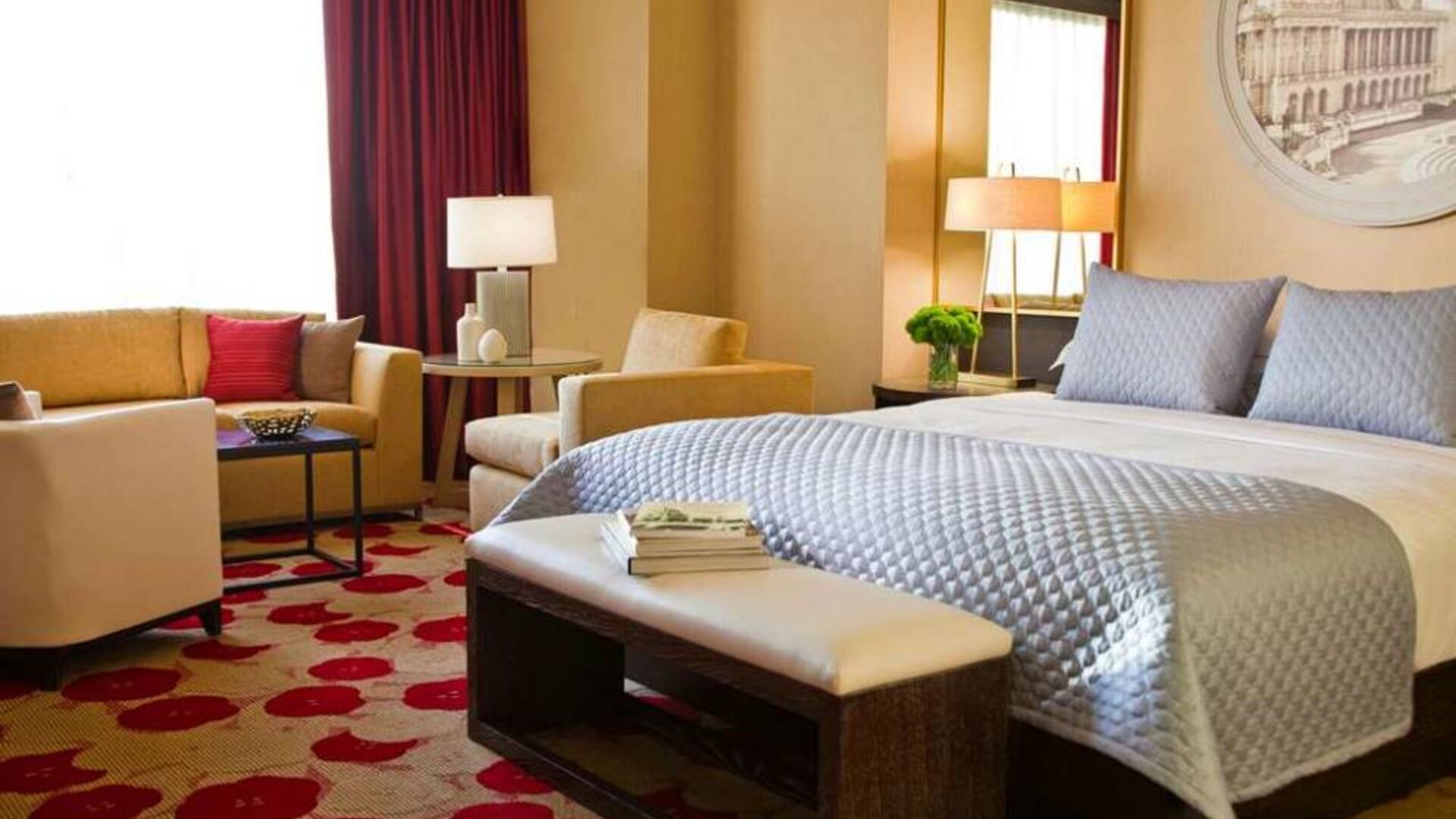 Royal Sonesta Chicago River North double bed guest room featuring chairs, coffee table, window, and a sofa.