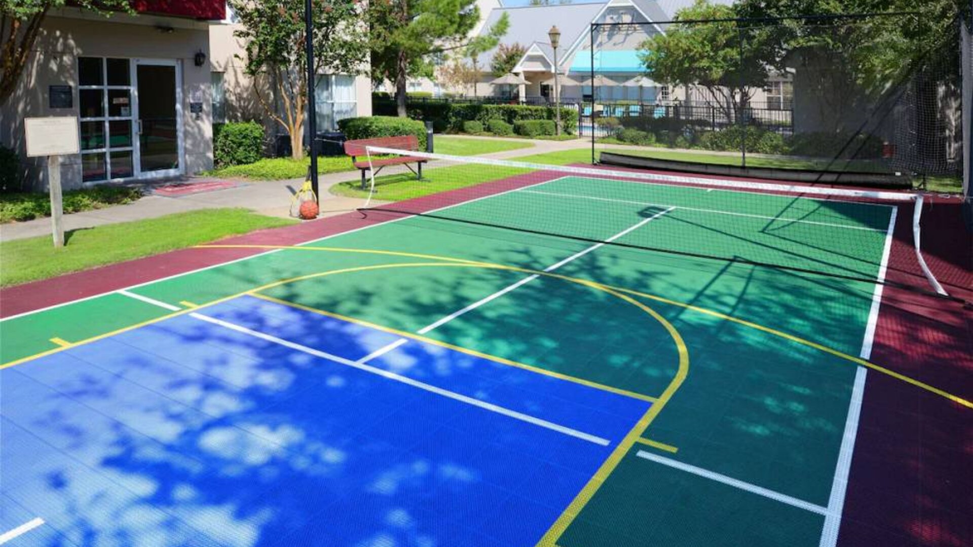 The hotel’s sports court is suitable for multiple activities including basketball and tennis, and has a bench for spectators.