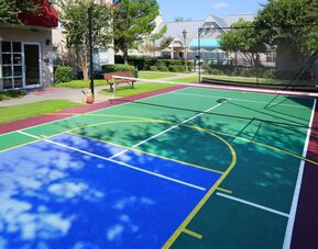 The hotel’s sports court is suitable for multiple activities including basketball and tennis, and has a bench for spectators.