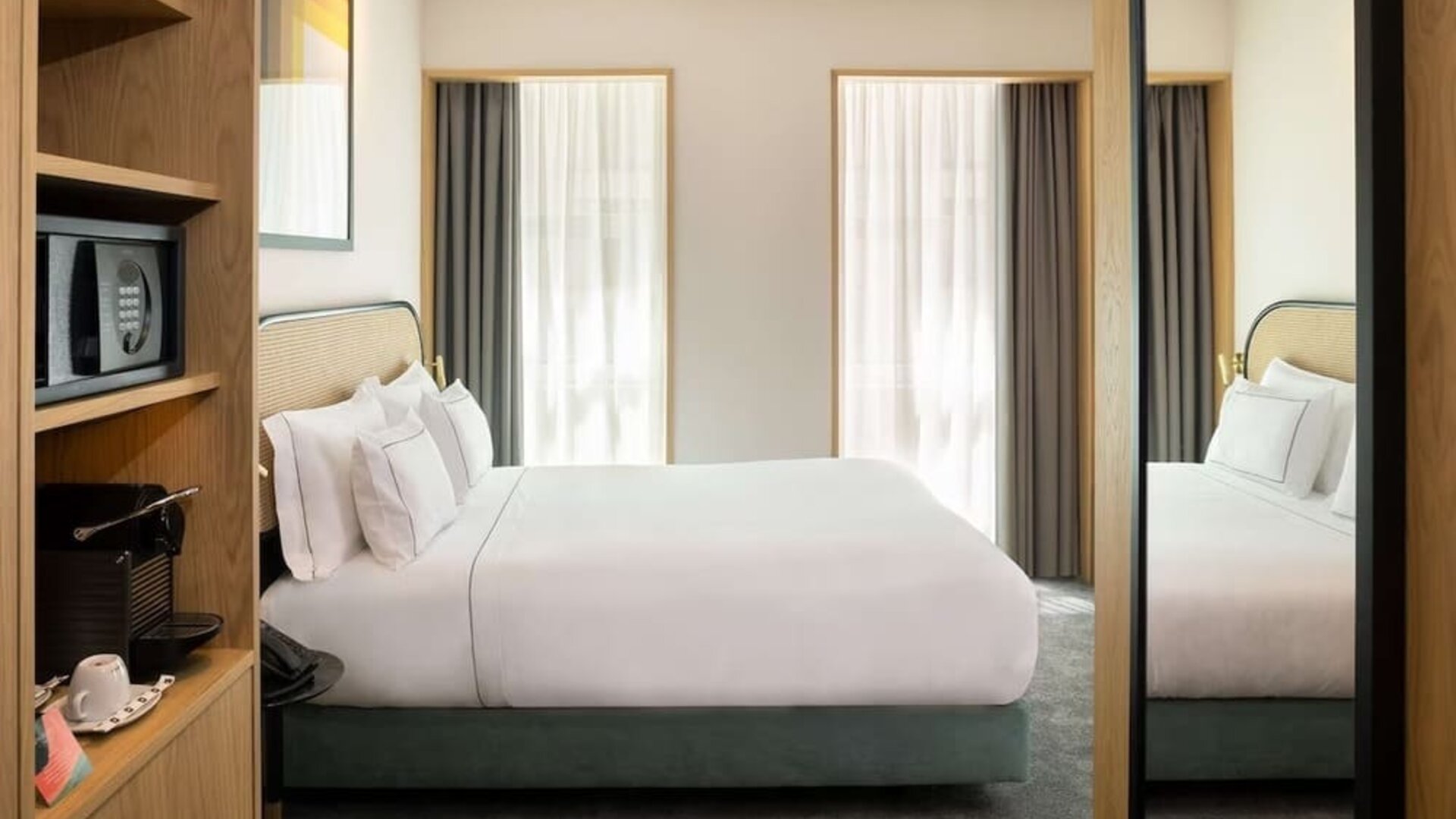 Day room with coffee machine and in-room safe at Arts Hotel Porto.