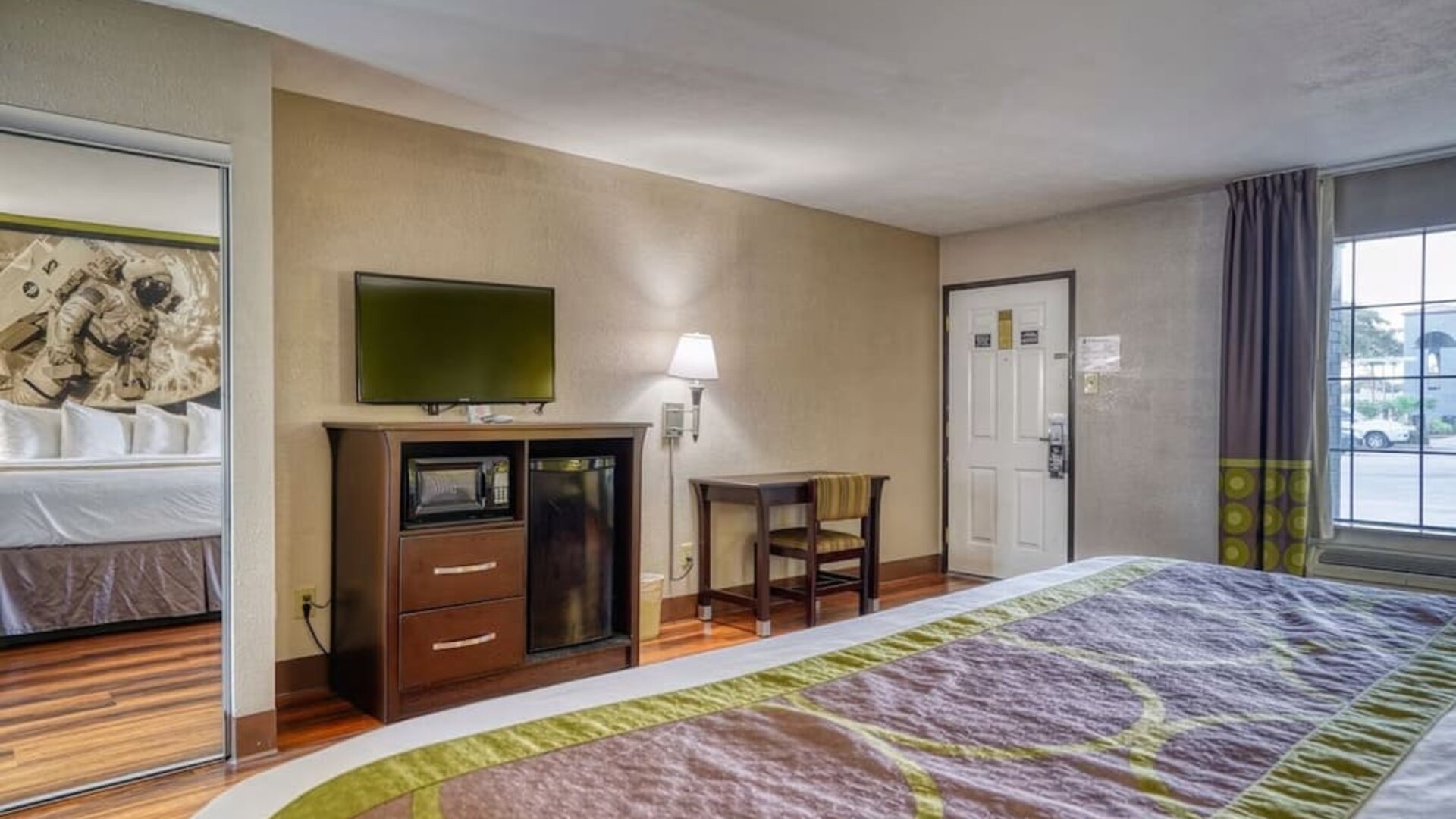 Day use room with TV and mini-fridge at Super 8 By Wyndham Houston/Webster.