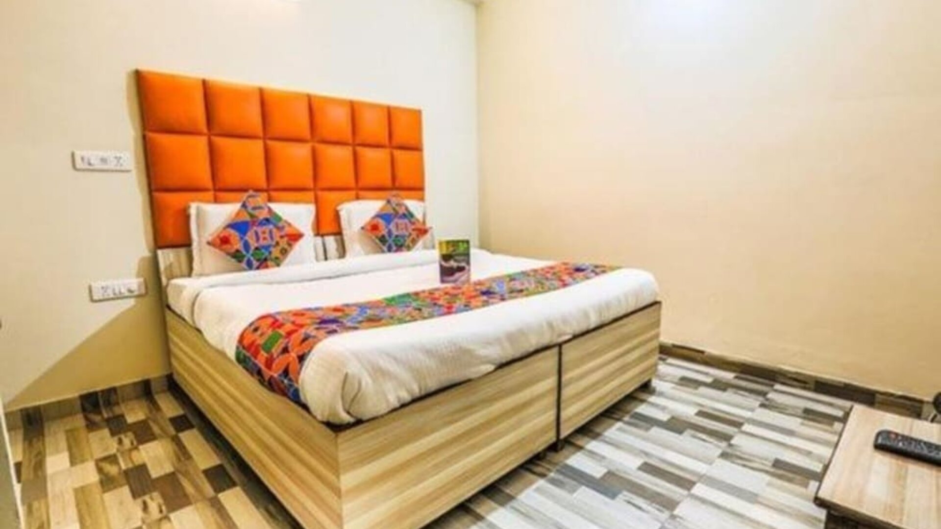 Comfortable king bed at Hotel Smart Stay. 