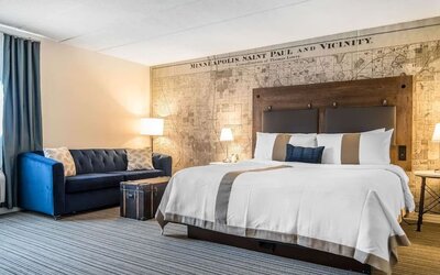 King bed with natural light at EnVision Hotel St. Paul South.