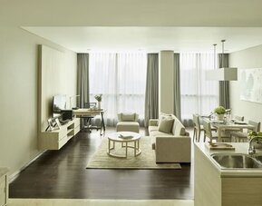 Spacious day room with kitchen and lounge at Fraser Residence Menteng Jakarta.