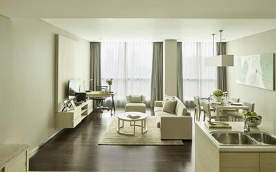 Spacious day room with kitchen and lounge at Fraser Residence Menteng Jakarta.