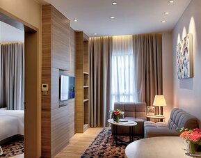 King room with lounge area at Capri By Fraser Johor Bahru.