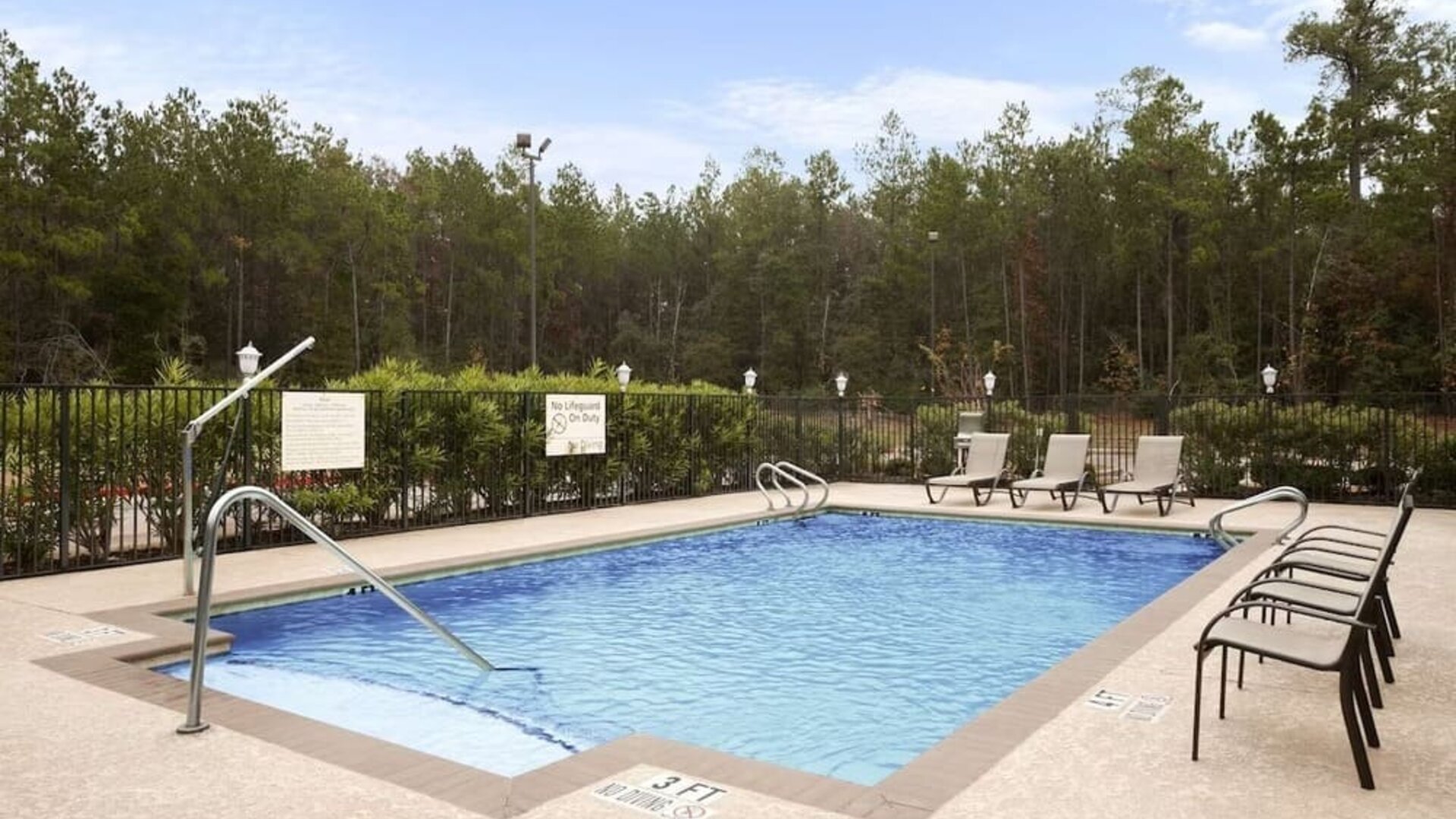 Relaxing outdoor pool at Hampton Inn & Suites Conroe - I-45 North.