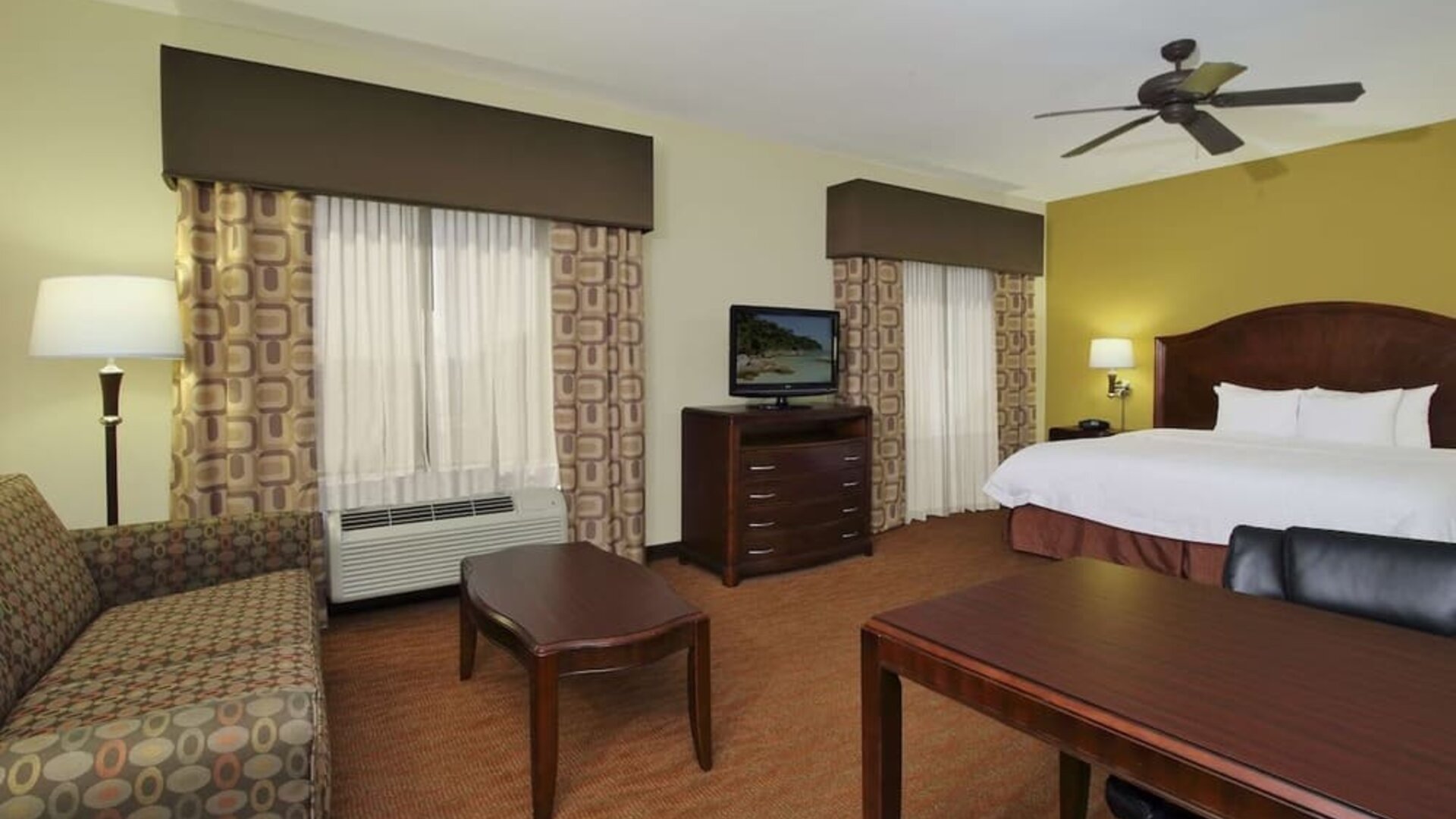 King room with TV and ceiling fan at Hampton Inn & Suites Conroe - I-45 North.