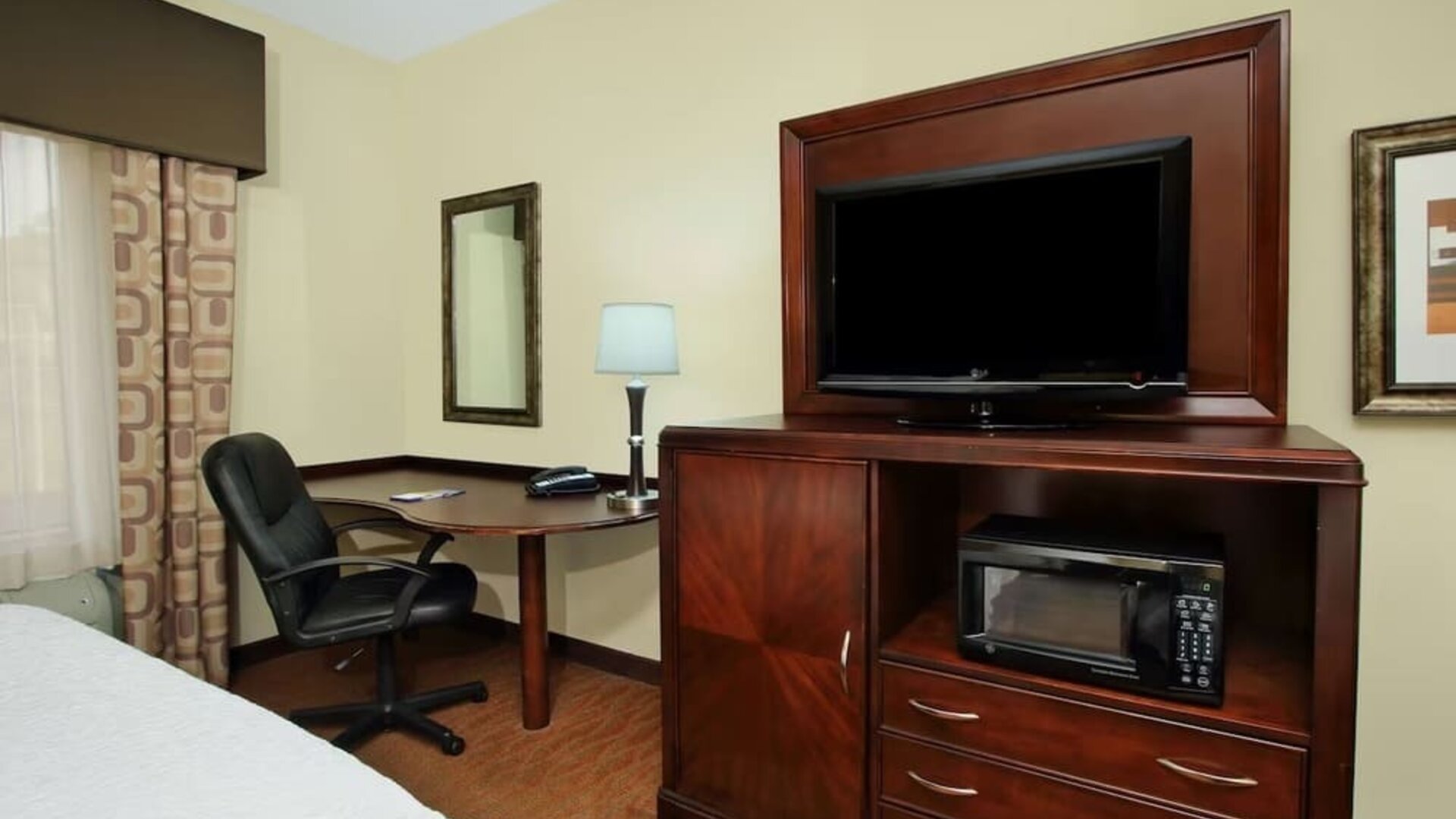 Day use room with TV and work area at Hampton Inn & Suites Conroe - I-45 North.
