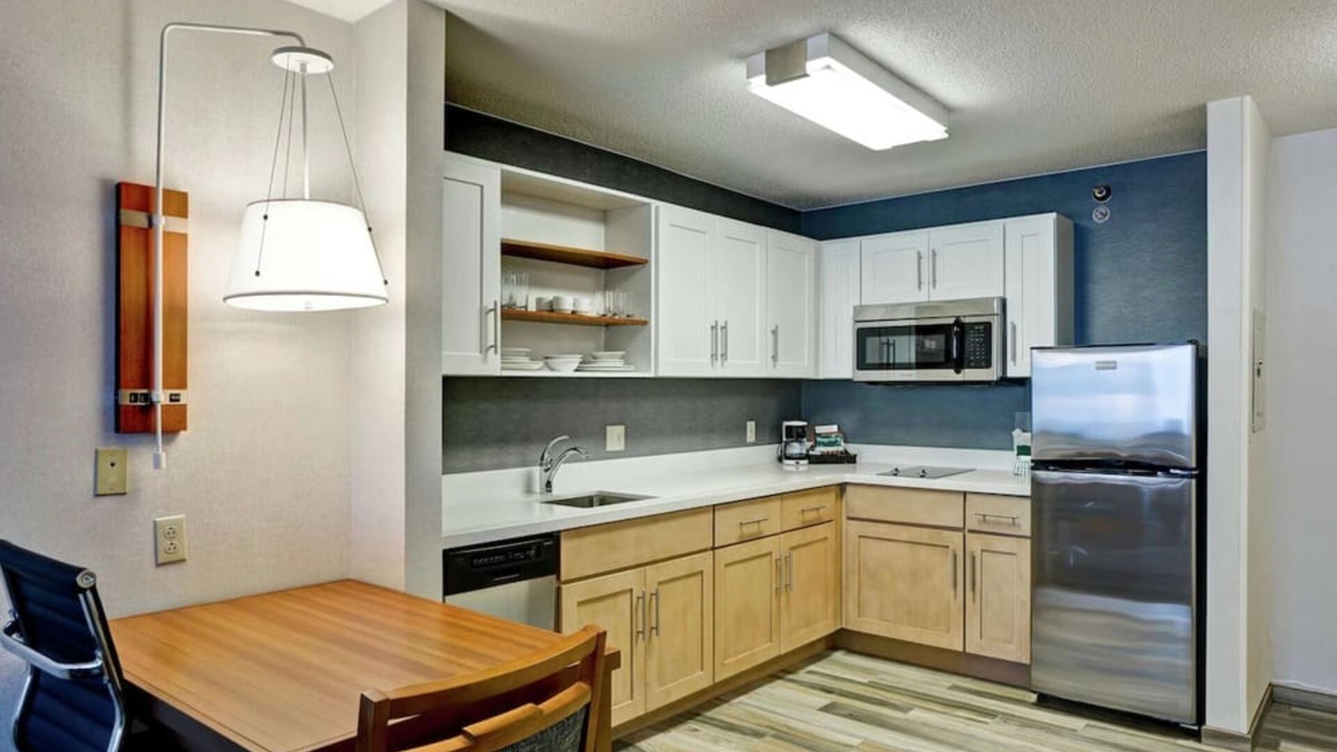 In-room kitchen at Homewood Suites By Hilton Chicago-Downtown.
