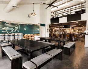 Relaxing coworking space at EnVision Hotel Miami International Airport.