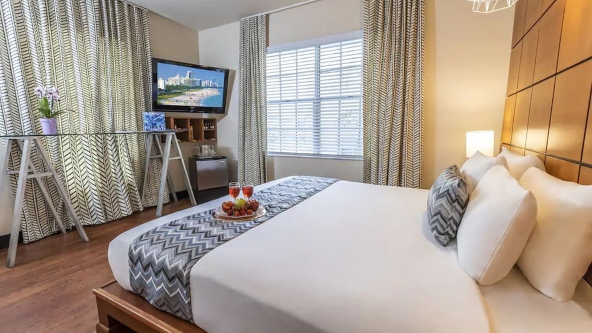 King room with TV and work space at Chesterfield Hotel & Suites.