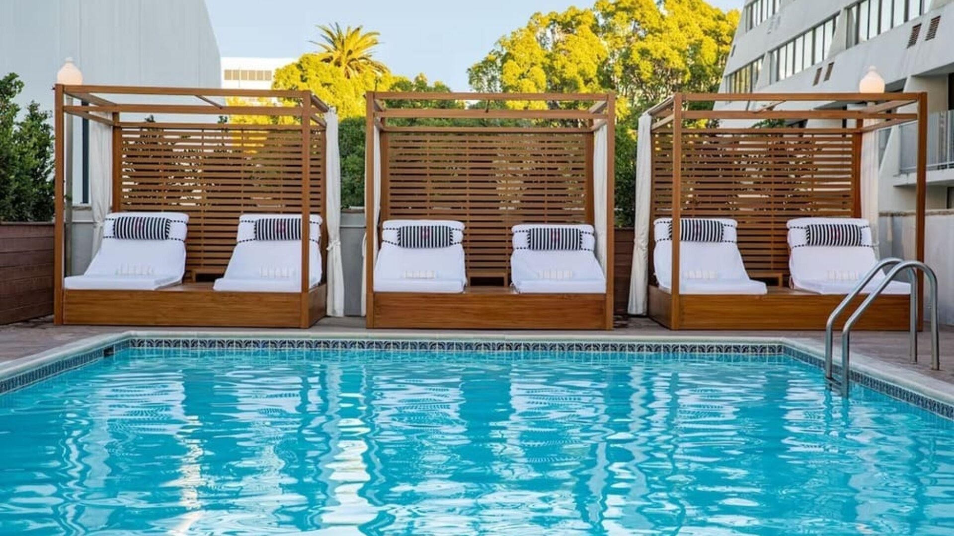Pool cabanas and pool chairs at Hotel Dena, Pasadena Los Angeles.
