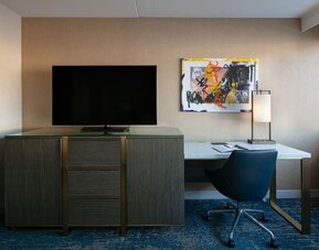 King room with TV and work station at Hotel Dena, Pasadena Los Angeles.