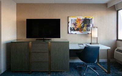 King room with TV and work station at Hotel Dena, Pasadena Los Angeles.