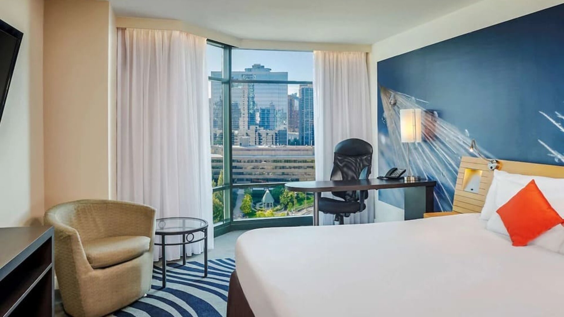 King room with TV at Novotel Toronto North York.