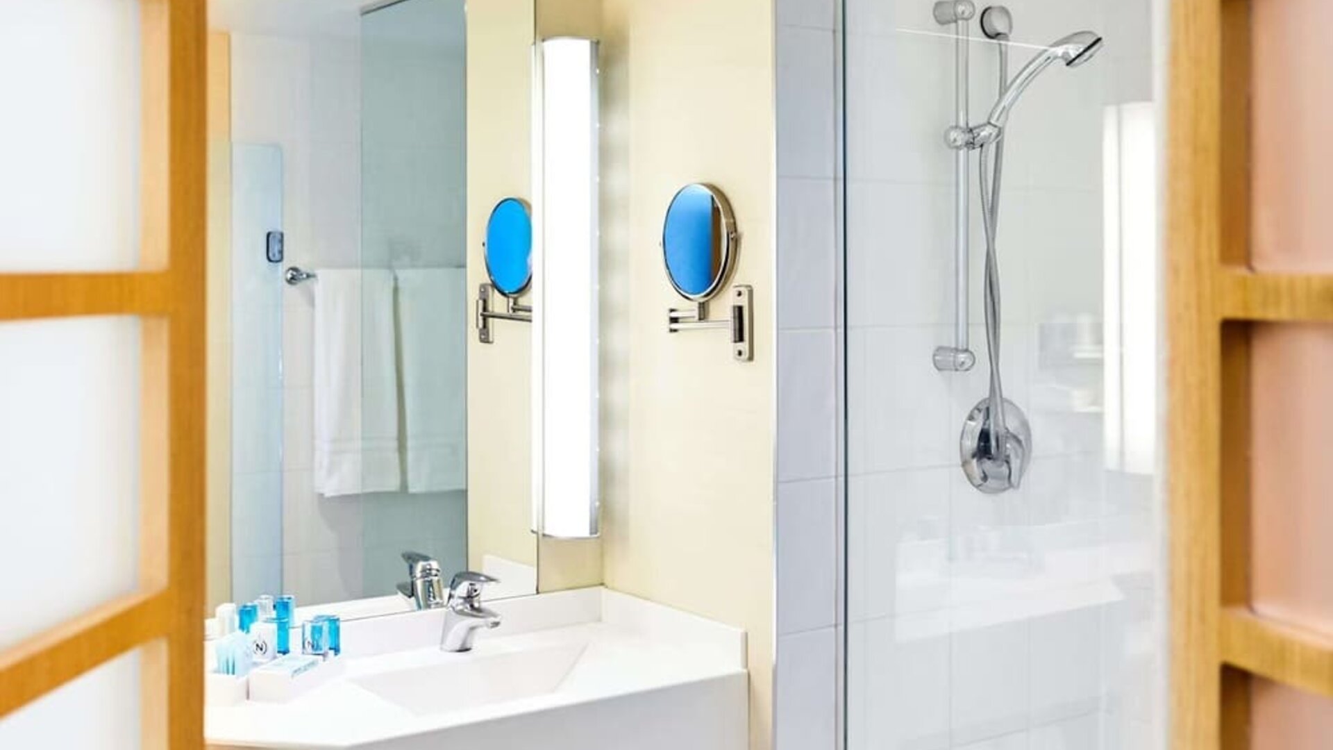 Guest bathroom with shower at Novotel Toronto North York.