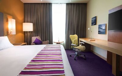Spacious king room with natural light at Hilton Garden Inn Monterrey Airport, Nuevo Leon, Mexico.