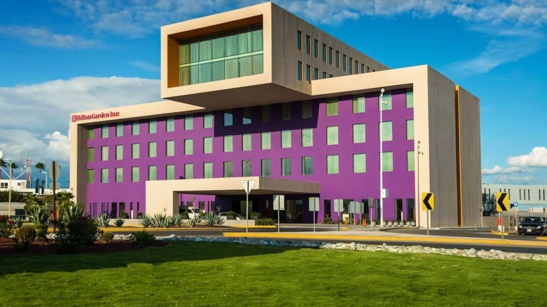 Hotel exterior and parking at Hilton Garden Inn Monterrey Airport, Nuevo Leon, Mexico.