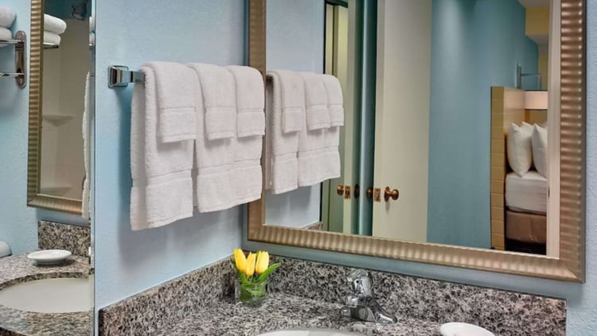 Sonesta ES Suites Tucson guest bathroom provides an ensuite shower and sink.