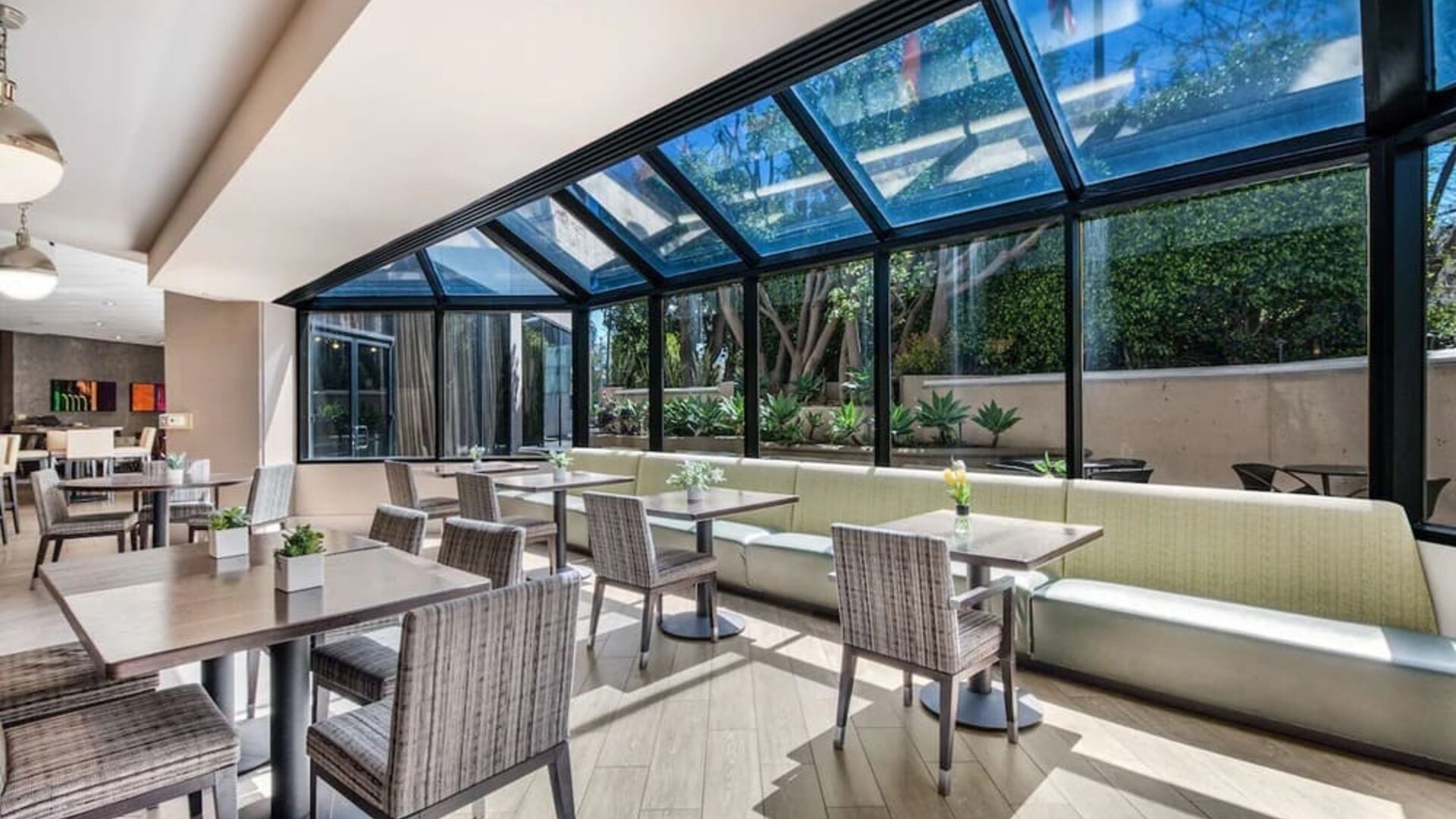 Dining area with natural light at Sonesta Los Angeles Airport LAX.