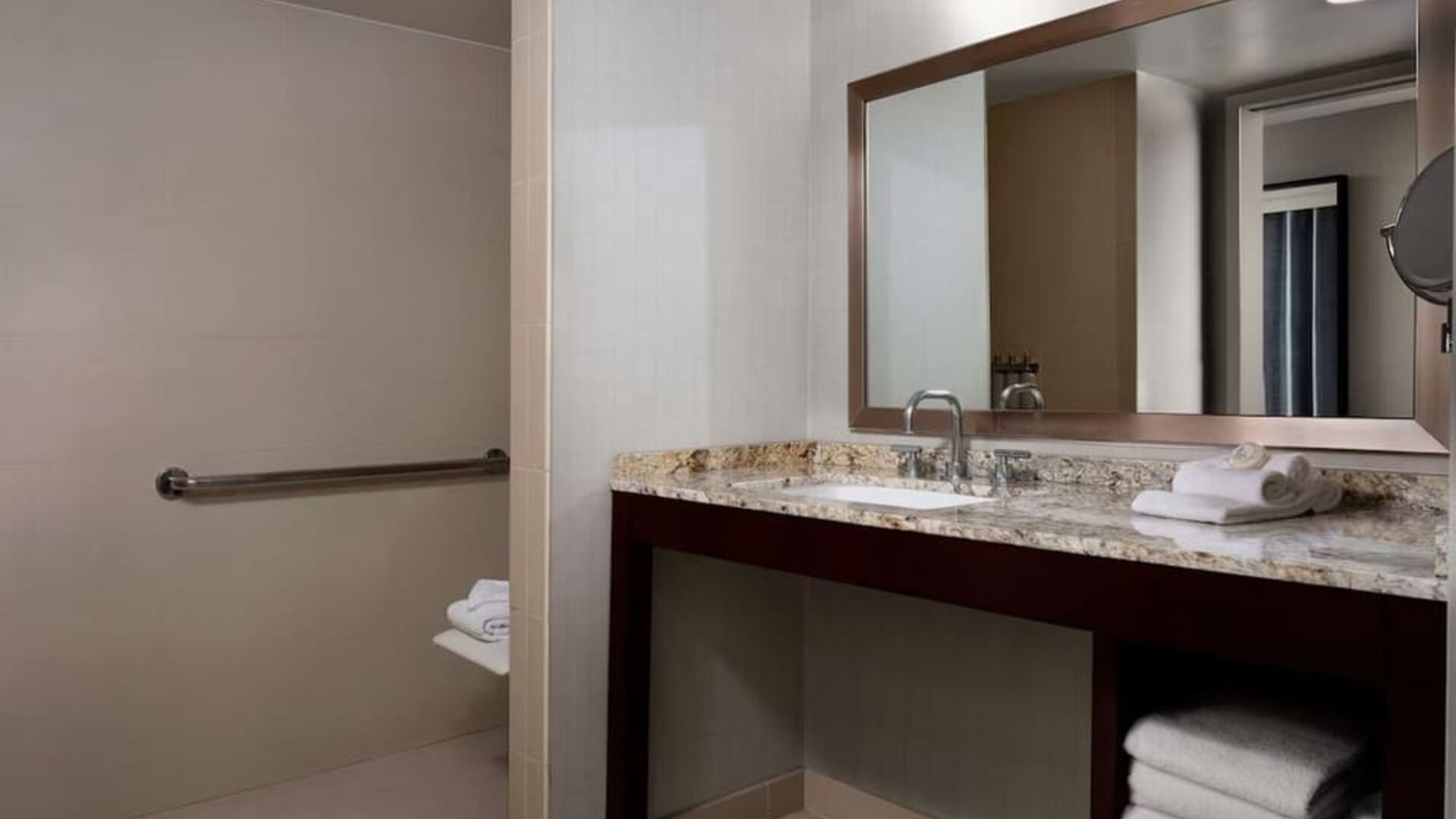 Guest bathroom with shower at Sonesta Redondo Beach & Marina.