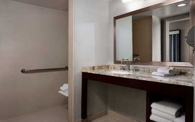 Guest bathroom with shower at Sonesta Redondo Beach & Marina.