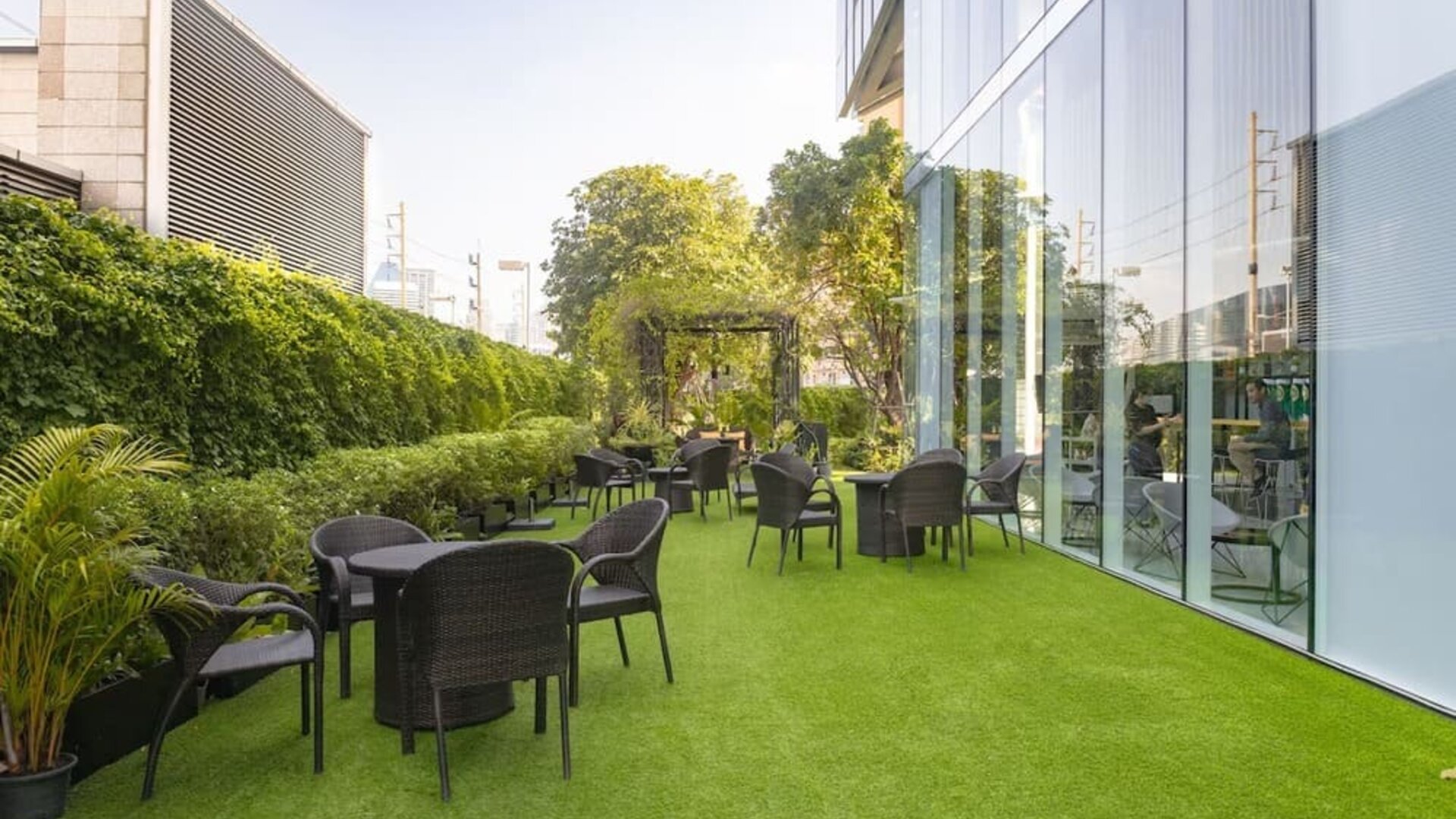 Outdoor garden with seating area at Modena By Fraser Bangkok.