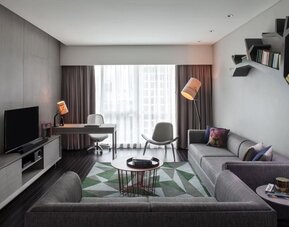 Spacious king room with lounge at Fraser Place Setiabudi Jakarta.