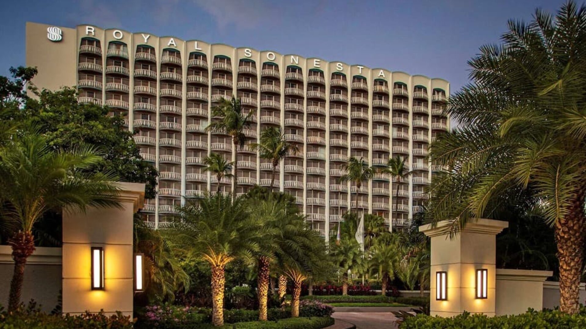 Hotel exterior at night at Royal Sonesta San Juan.